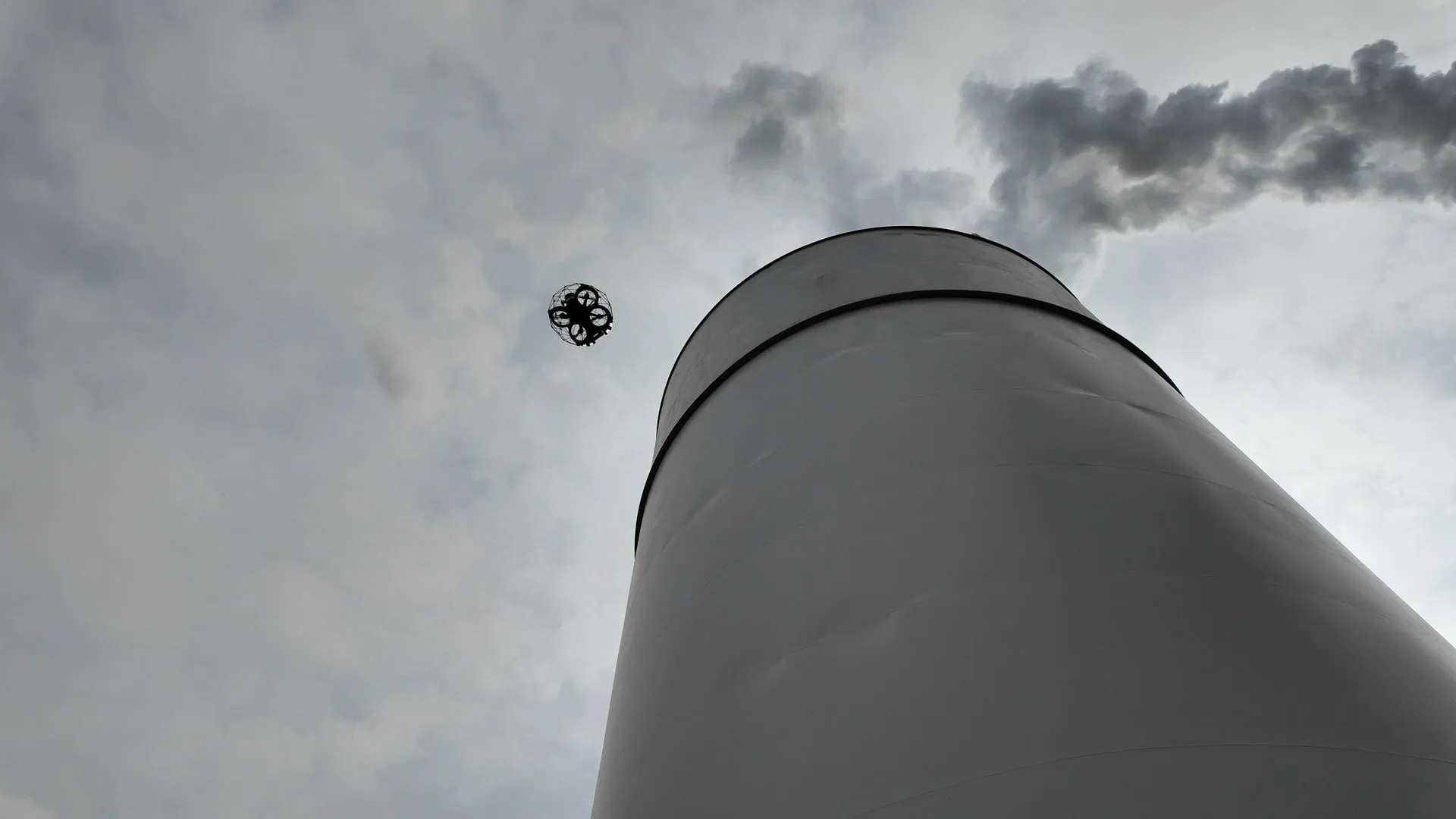 ELIOS 3 flying outside at industrial tank for external inspection