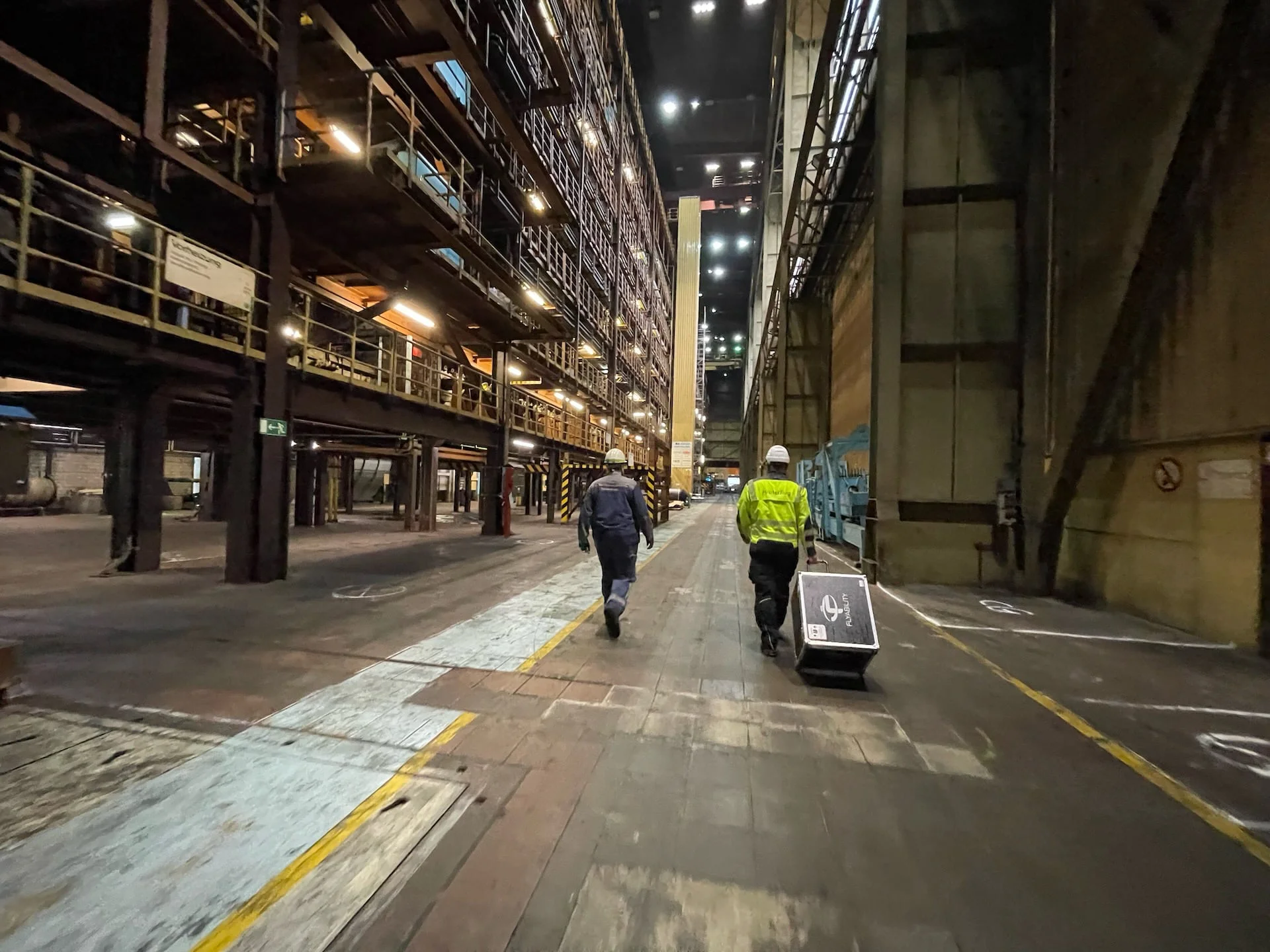 Kopterflug team preparing for industrial drone inspection in a steel mill