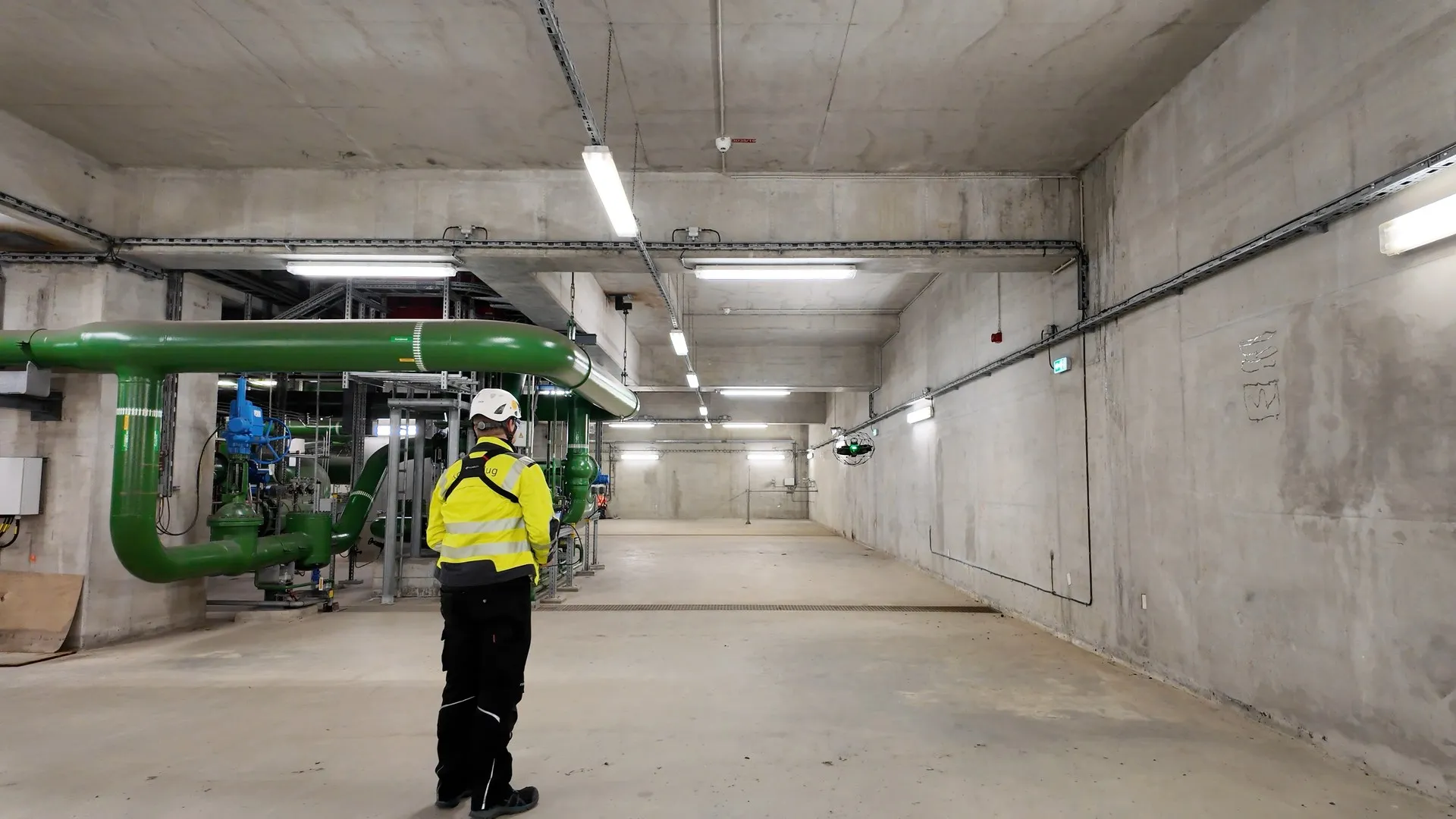 Drone pilot flying the ELIOS 3 for LiDAR mapping and surveying inside an industrial facility